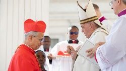 Pope Leo XIV (then Cardinal Robert Prevost) receives the red hat from the late Pope Francis on September 30, 2023