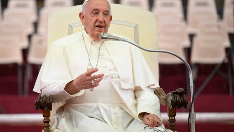 Pope Francis greets choristers at an audience in the Paul VI Hall 