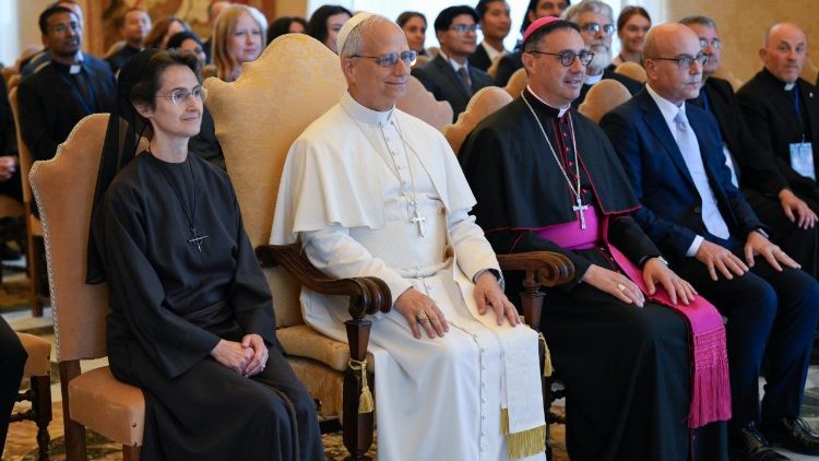 Pope Leo XIV takes a group photo with Summer School participants