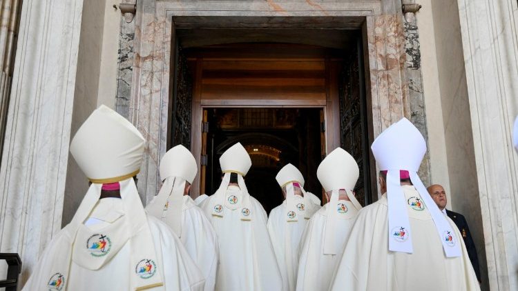 Bishops pass throught the Holy Door of St Peter's Basilica