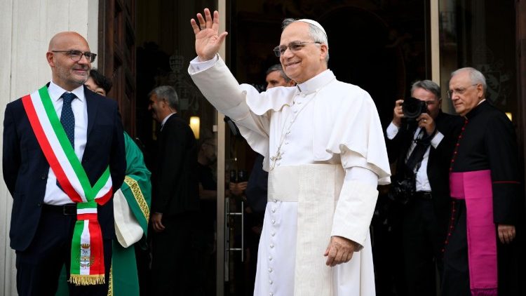 Pope Leo greets the crowds in the square in front of the parish of Saint Thomas of Villanova