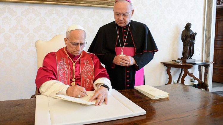 Pope Leo signing the Apostolic Exhortation "Dilexi te"
