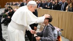 Pope Leo XIV blesses a young person in a wheelchair
