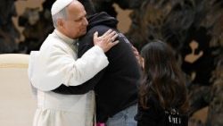 Pope Leo embraces a young man