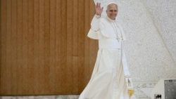 Pope Leo XIV waving at the faithful gathered at his Wednesday General Audience