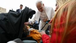 Pope Leo XIV blesses a sick child at the Wednesday General Audience on March 4, 2026