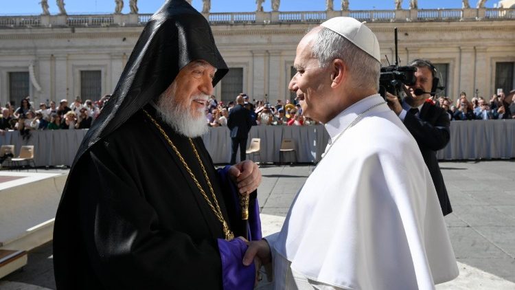 Pope Leo XIV shakes hands with Armenian Catholicos Aram I as he arrives at the Wednesday General Audience