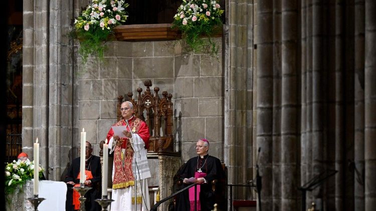 Pope Leo reads his homily to those gathered in the cathedral