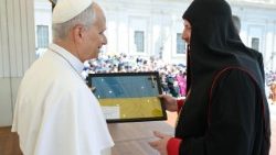 Cardinal Bychok gifting Pope Leo XIV a cross and Ukrainian flag that belonged to a soldier