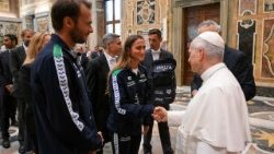 Pope Leo XIV shakes hands with members of the Italian Swimming Federation