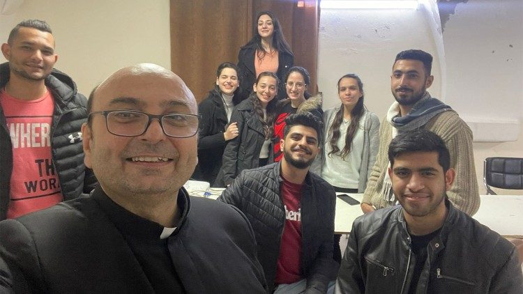 Father Gabriel Romanelli with young people of his parish in Gaza