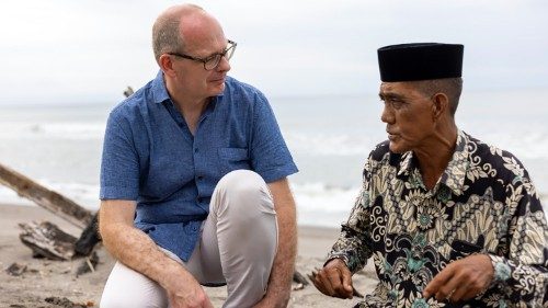 Brother Michael Schöpf speaks with a local traditional leader who welcomed Rohingya Refugees, in Aceh, Indonesia, July 2023