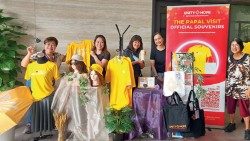 CANA volunteers with official PFS2024 souvenirs at the SFX Seminary Building. Photo by Natalie Tse via Catholic News SG