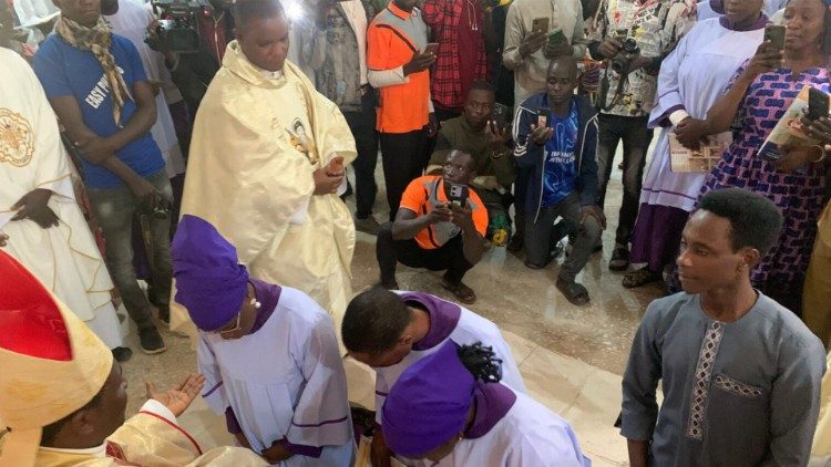 Bishop Gerald Musa blessing some of the catechists