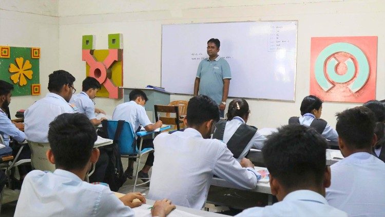 Niaz Morsher, a Civil Technology teacher, instructs students in the classroom (Photo by Stephan Uttom Rozario)