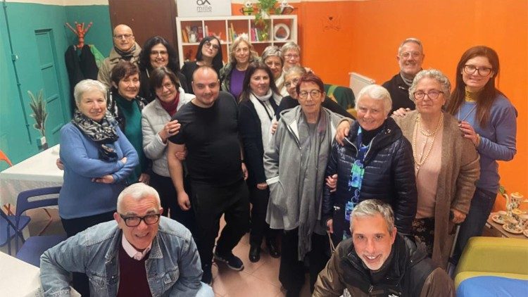 Photo of people who have been helped by Caritas Albano’s services. In the bottom right is the Director of Caritas Albano, Alessio Rossi.