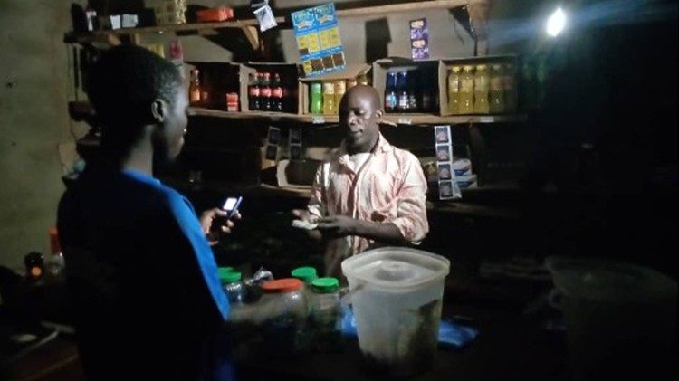 A family that received solar lights uses them to run their shop at night. Before, they had to close by 6 p.m.