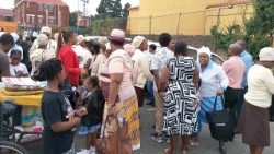 (File) Some migrants interact after Mass