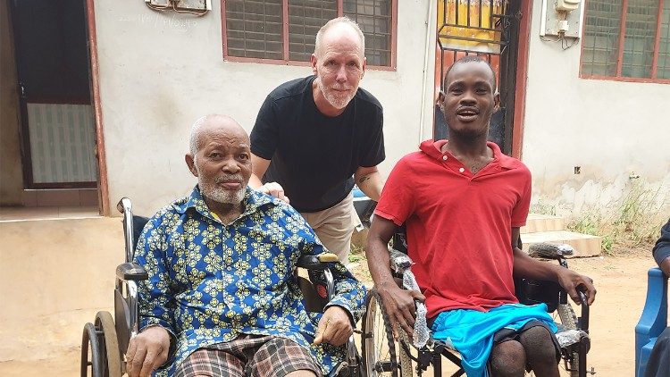 SMA lay missionary Steve Phillips with two friends he assists with Hope for Life