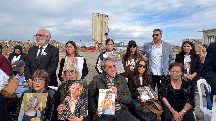 The victims with photos of their family members 