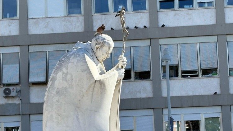 Rome's Gemelli Hospital with the statue of St. Pope John Paul II