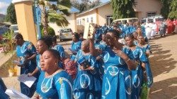 Tanzanian Catholic faithful sing as they take part in a procession