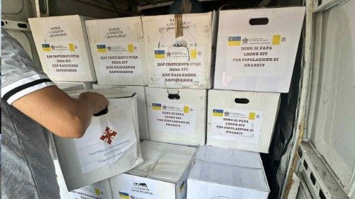 Aid packages are loaded aboard a truck to help suffering families in Kharkiv, Ukraine