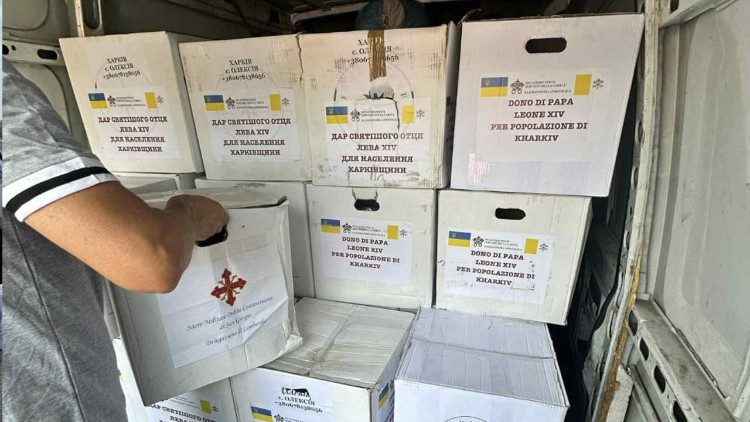 Aid packages are loaded aboard a truck to help suffering families in Kharkiv, Ukraine