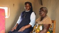 Sr. Beatrice Odinyu shares a moment with an elderly beneficiary during community outreach