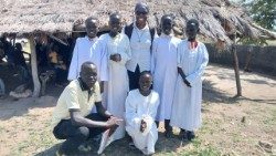 Sr. Linah Siabana with altar servers after a communion service