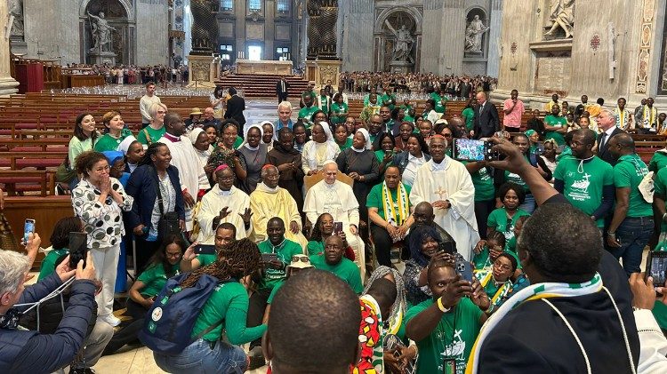 Pope Leo XIV takes a group photo with those who attended the Mass in St. Peter's Basilica on May 26, 2025