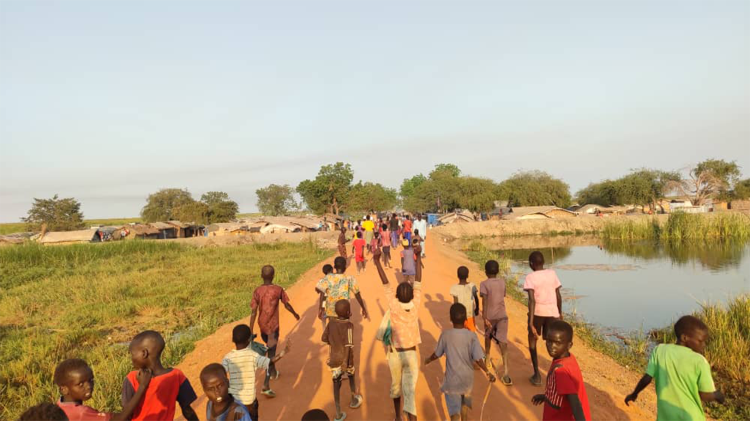 Young people walking on a path in South Sudan