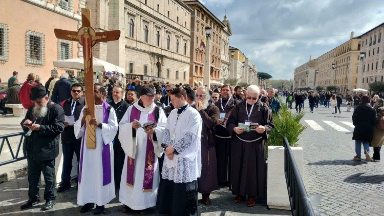 Jubilee Pilgrims process along the Via della Concilliazione to St Peter's Basilica