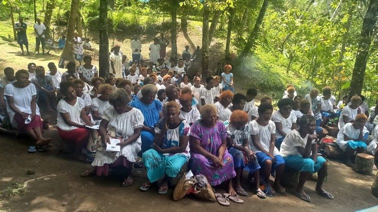 School children at Holy Mass at Taogo the farmstead of the families of Blessed Peter To Rot 