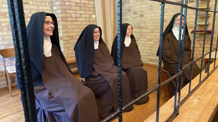 Cloistered nuns from the Carmelite monastery speak with journalists