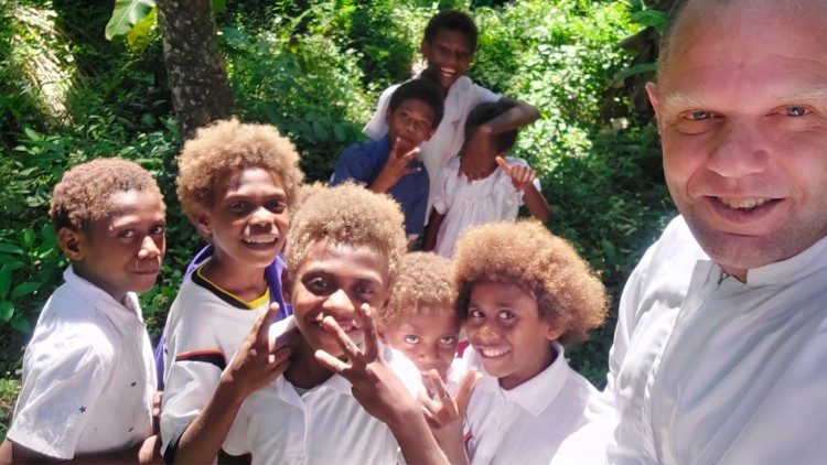 Fr Ravaioli in Papua New Guinea with relatives of the Blessed Peter To Rot