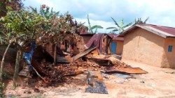 Houses lie in ruins after militants attacked the village of Ntoyo, in the Democratic Republic of Congo