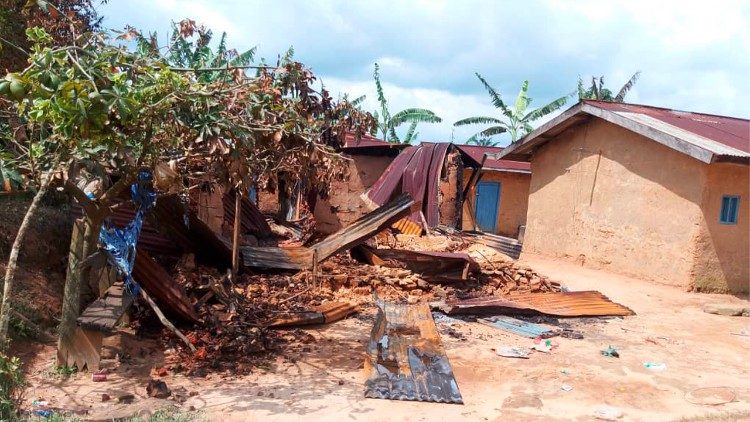 Houses lie in ruins after militants attacked the village of Ntoyo, in the Democratic Republic of Congo