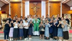 Participants of the annual retreat for the Deaf and Hard of Hearing pose with clergy after Mass in Samphran, west of Bangkok, forming heart signs in Thai Sign Language as a symbol of faith and unity. Photo: Fr. Peter Bhuravaj Searaariyah
