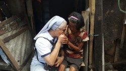 Sr. Lourdes visits a woman who has cancer