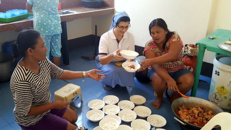 Rubi, Sr. Luz and Lucy prepare a meal for the "Feeding Program"