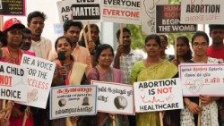 Participants hold placards affirming the dignity of life. Photo credits: Seon Jose