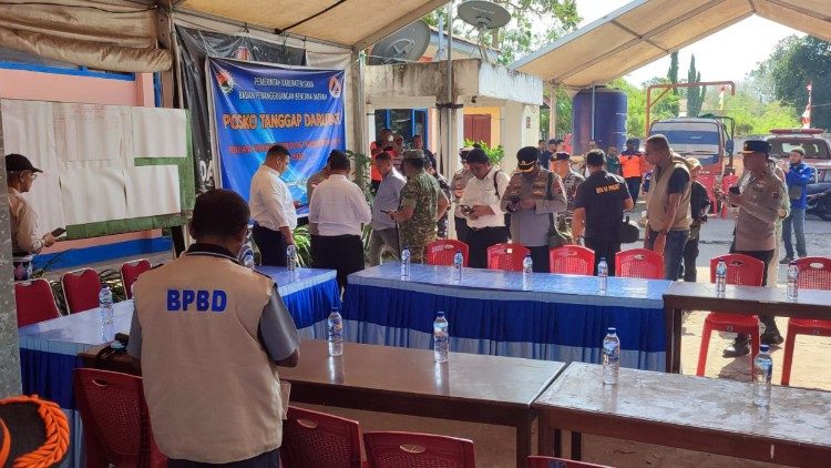 Community in Flores, Indonesia, assisting in relief efforts