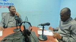 Mr Moisés Malumbu (left), former Vatican News professional talks to Rádio Ecclesia in Luanda
