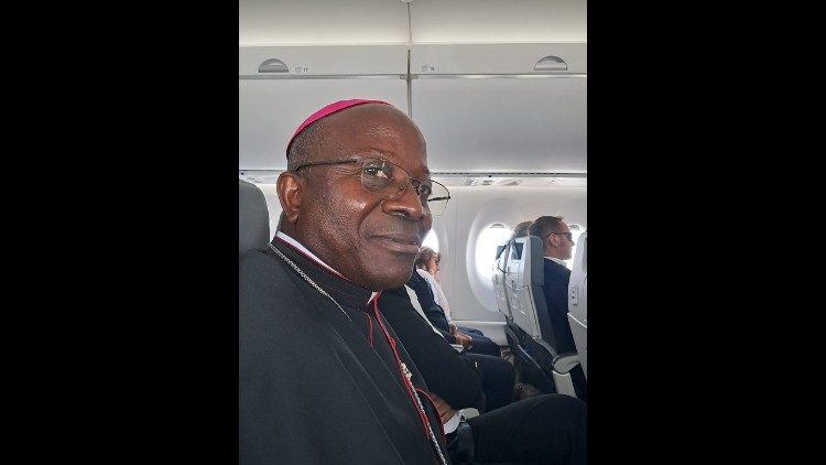 Bishop Estevao Binga on the plane from Sauriom