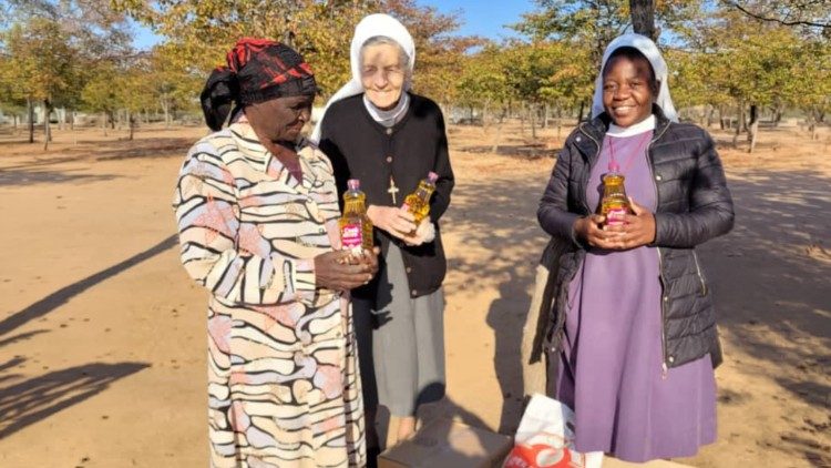 Sr. Ludbirga Schumacher CPS and Sr. Felistar Dube CPS with one of the beneficiaries of the project