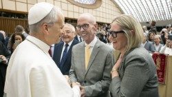 John Allen, with his wife, Elise Allen, greeting Pope Leo XIV