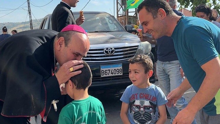 Archbishop Borgia with residents from the Christian villages reached by the humanitarian aid convoy