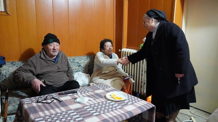 Sister Marie Touma, superior of the Antonine Sisters, speaks to people who fled Hadath and have taken shelter at the convent.