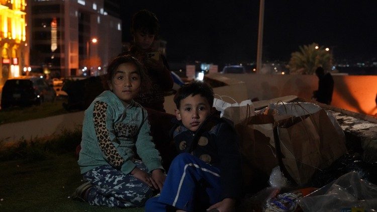 Lebanese children, displaced by the Israeli military’s evacuation orders, sit in Martyrs’ Square in Beirut.